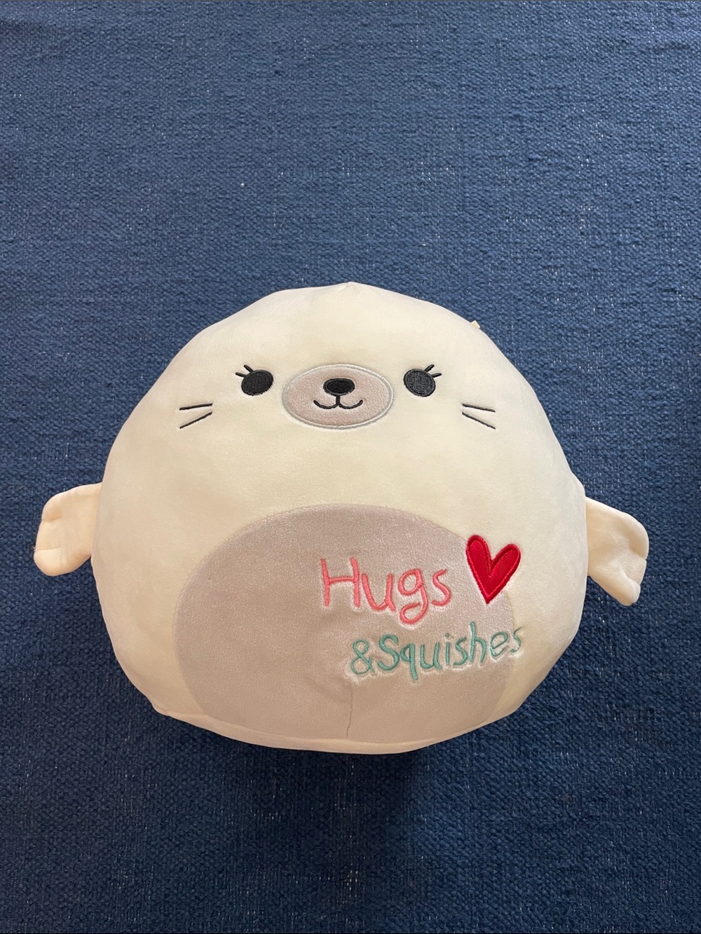 Squishmallows Cream Seal Plush with Red & Teal Embroidery